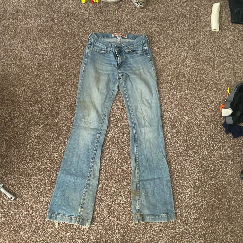 Worn bootcut jeans